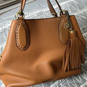 Light Brown Michael Kors shoulder bag/tote.  Gold details. 1 blemish on side.